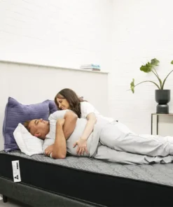 Couple-cuddling-on-Sleep-Firm-Mattress