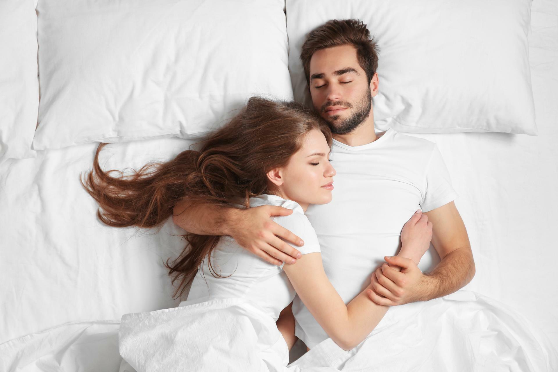 couple-sleeping-happy-on-bed